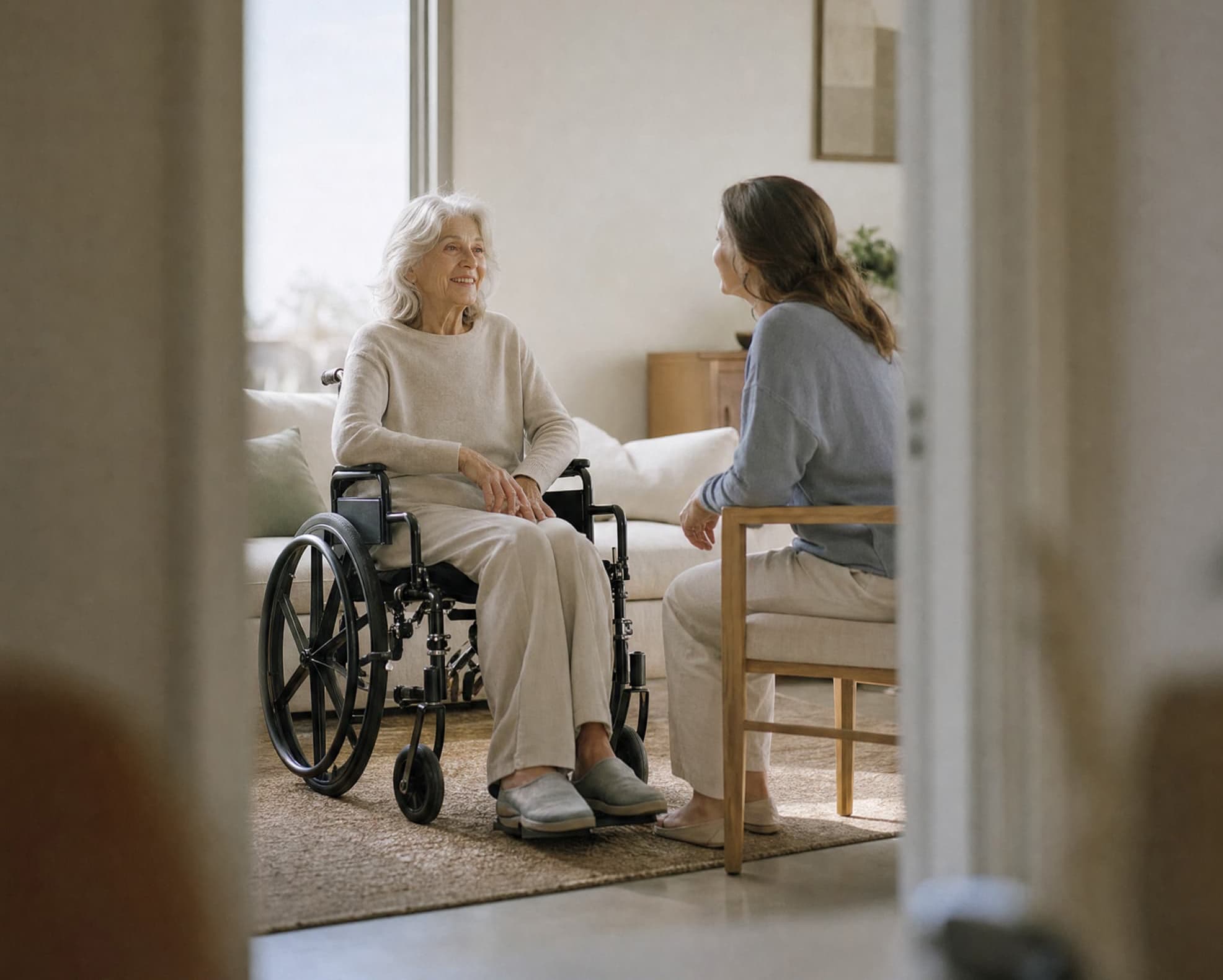 Senior woman smiling during a warm in-home care consultation with an Ativo care coordinator